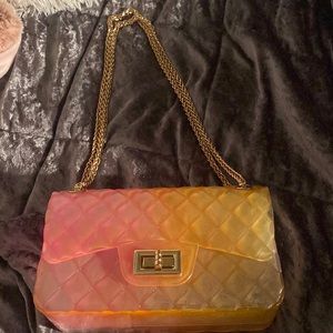 This is a purse that has a kind of ombre look.